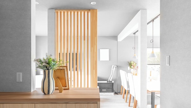 A modern interior with a wooden reception desk, a potted plant, and a sliding wooden partition. - THE ARBANO (Furano)