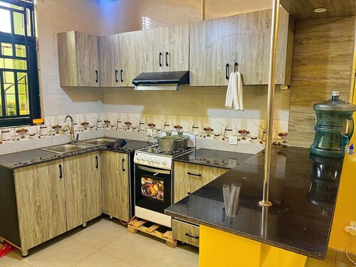 5 minute ride to the Kigali Genocide Memorial. Double room with balcony