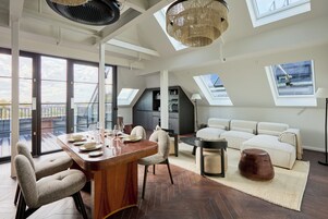 Penthouse Studio | Living area | 43-inch Smart TV with digital channels, streaming services