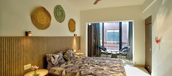 Relaxing 1BHK at Vagator, French windows