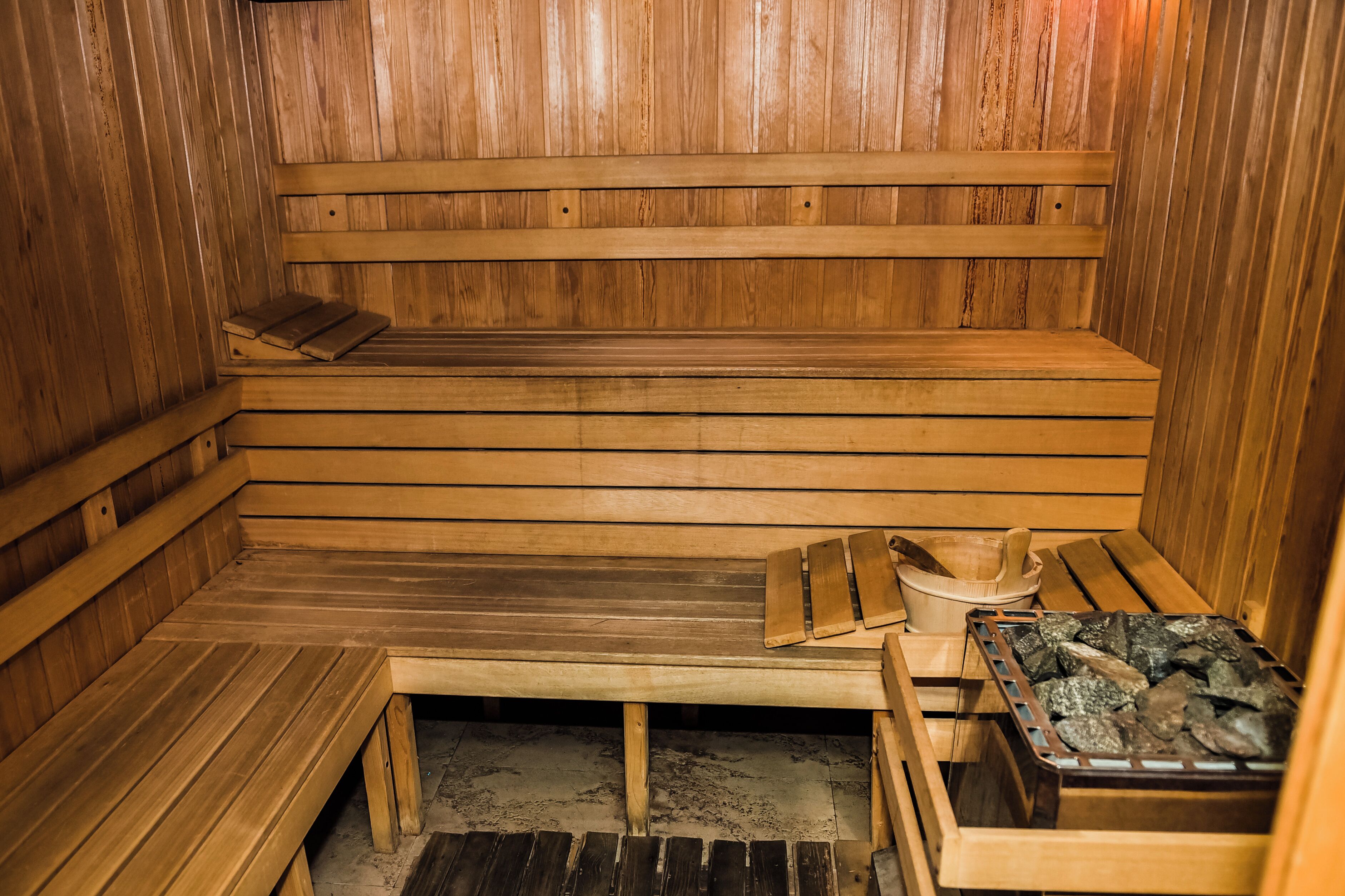 A wooden sauna with benches, a bench seat, a bench with a towel, a bench with a towel, a bench with a towel, a bench with a towel, a bench with a towel, a bench with a towel, a bench with a towel, a bench with a towel, a bench with a towel, a bench with a towel, a bench with a towel, a bench with a towel, a bench with a towel, a bench with a towel, a bench with a towel, a bench with a towel, a bench with a towel, a bench with a towel, a bench with a towel, a bench with a towel, a bench with a towel, a bench with a towel, a bench with a towel, a bench with a towel, a bench with a towel, a bench with a towel, a bench with a towel, a bench with a towel, a bench with a towel, a bench with a towel, a bench with a towel, a