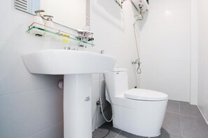 Shower, hair dryer, slippers, towels