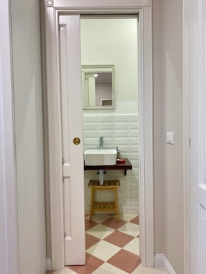 Shower, hair dryer, slippers, towels