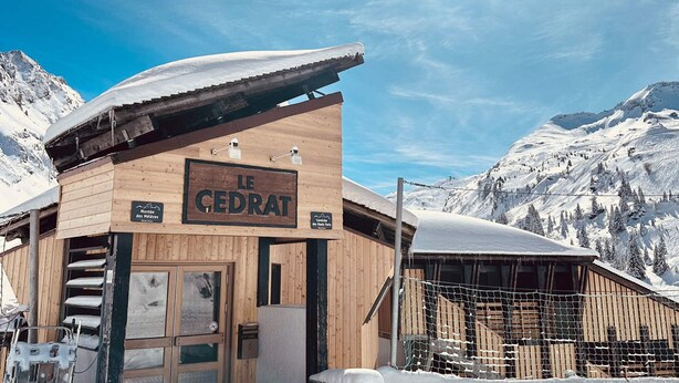 A wooden mountain lodge named "Le Cedrat" with a signboard, wooden exterior, and a view of snow-covered mountains. - Charming 2-room cabin for 6, ski-in/ski-out access (Avoriaz)