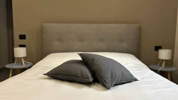 Iron/ironing board, travel crib, free WiFi, bed sheets