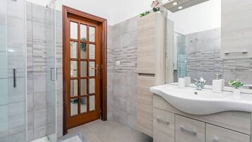 Shower, free toiletries, hair dryer, bathrobes