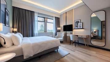 Habitación ejecutiva | Minibar, sistema de insonorización, tabla de planchar con plancha
