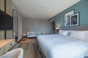 Habitación ejecutiva | Minibar, sistema de insonorización, tabla de planchar con plancha