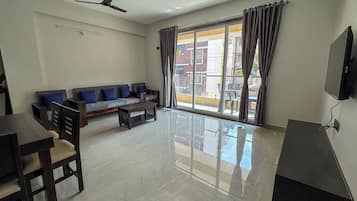 Deluxe Apartment, Balcony, Sea View | Living area