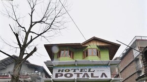 A two-story building with a sign reading "HOTEL POTALA". - Hotel Potala Manali (Manali)