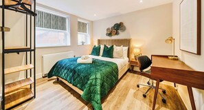 1 bedroom, desk, iron/ironing board, travel crib