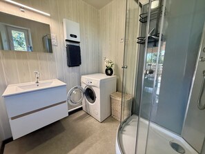 Shower, hair dryer, towels, toilet paper