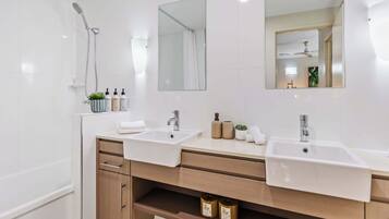 Shower, hair dryer, towels, shampoo