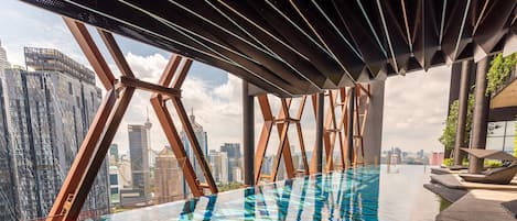 Outdoor pool, open 7:00 AM to 11:00 PM, pool loungers