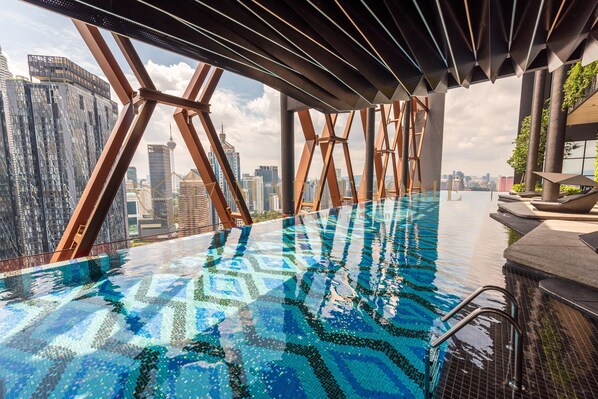 Outdoor pool, open 7:00 AM to 11:00 PM, pool loungers