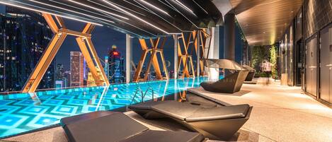 Outdoor pool, open 7:00 AM to 11:00 PM, pool loungers