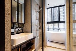 Premium Suite, 1 Queen Bed, Bathtub | Bathroom | Free toiletries, hair dryer, bidet, soap