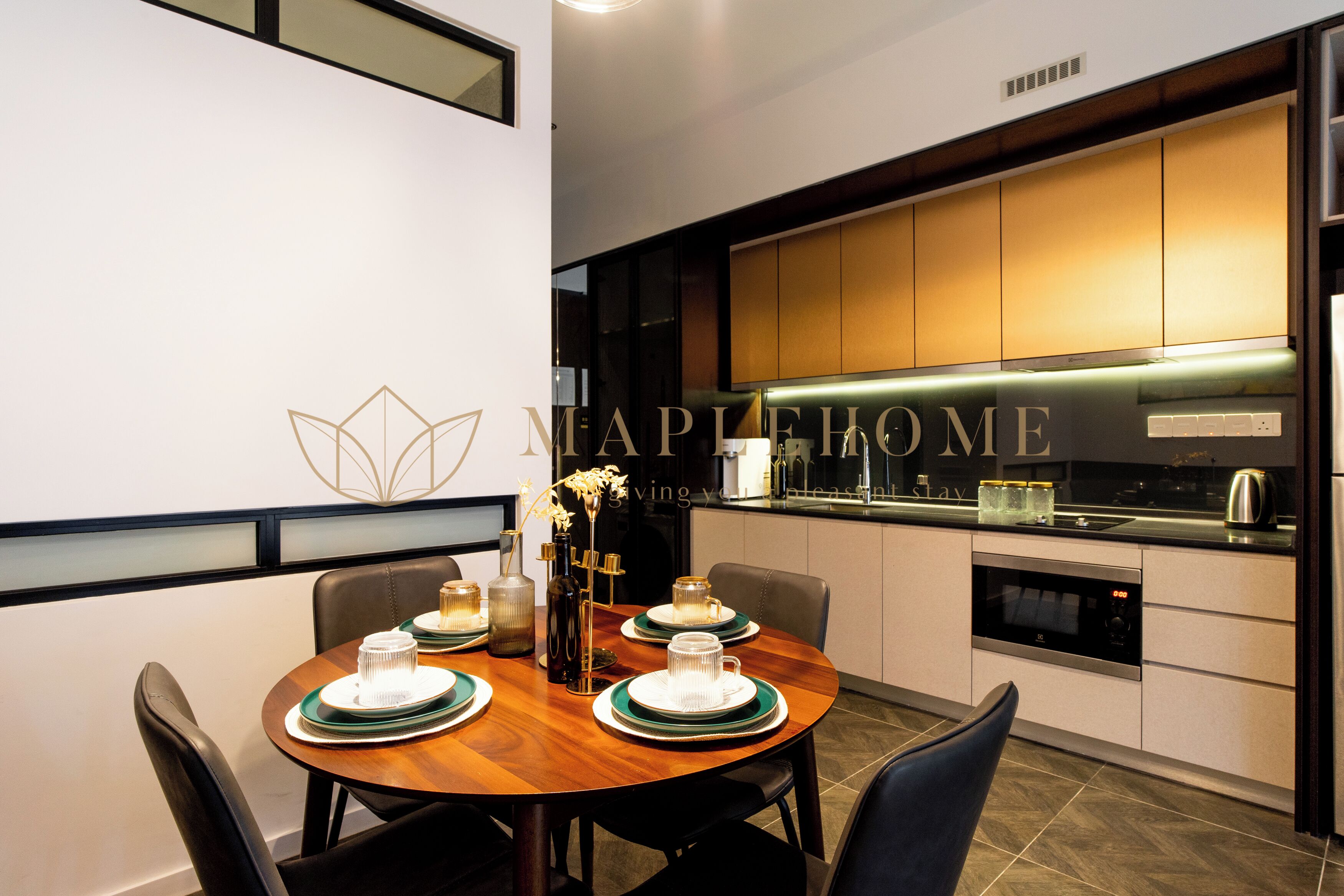 A modern kitchen with a dining area.