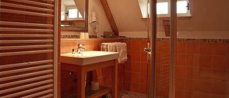 Shower, hair dryer, towels, toilet paper