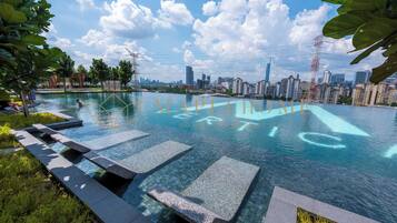 Outdoor pool, open 7:00 AM to 11:00 PM, sun loungers