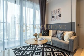 Suite Deluxe, 1 chambre, balcon | Coin séjour