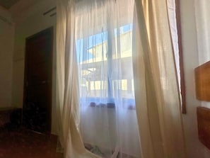 Basic Double Room, City View | In-room safe, blackout drapes, soundproofing, iron/ironing board