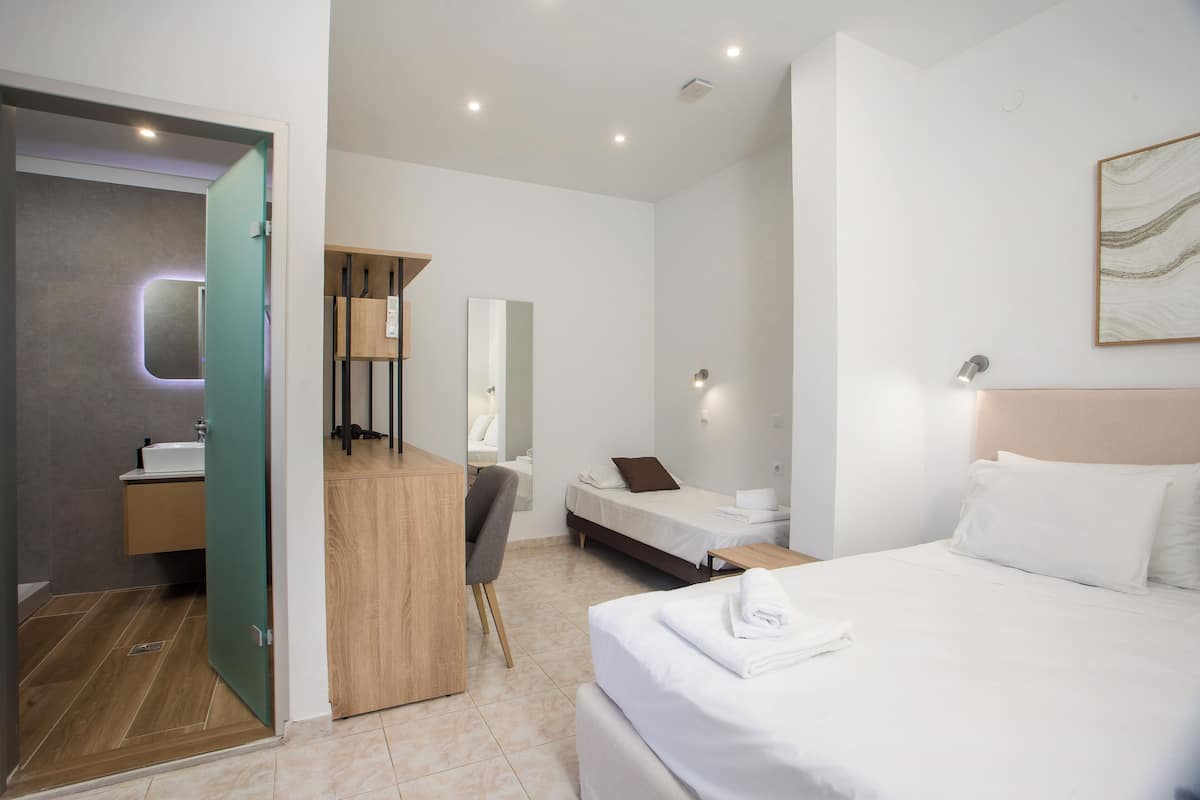 Standard Triple Room | In-room safe, desk, laptop workspace, blackout drapes