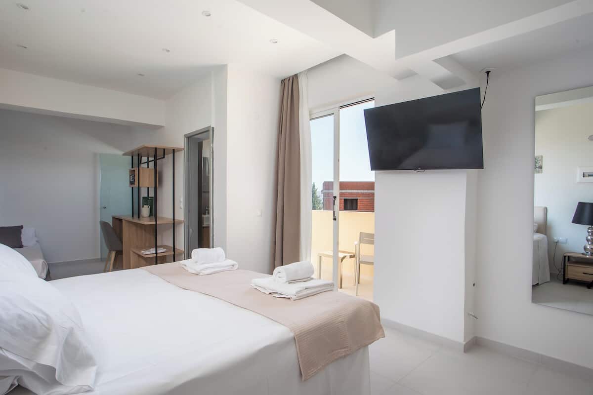 Superior Triple Room | In-room safe, desk, laptop workspace, blackout drapes