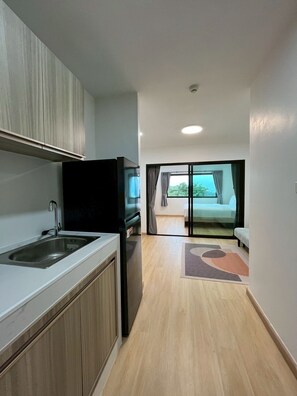 Junior Suite, Sea View | Private kitchen | Fridge, microwave