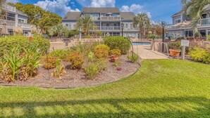 A hotel with a pool, outdoor seating, and a well-maintained garden. - 4 Mi to Beach: Unit w/ Pool Access in Little River (Little River)