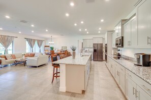 A spacious kitchen with a large island, modern appliances, and ample counter space. - 2 Mi to Golf! Punta Gorda Gem w/ Pet-friendly Yard (Punta Gorda)