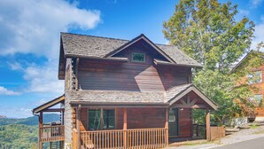 A wooden cabin with a balcony, large windows, and a porch. - Ski & Hike: Mars Hill Mountaintop Cabin w/ Views (Mars Hill)