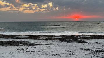 On the beach, sun loungers, beach towels