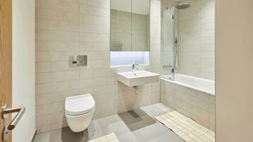 Shower, hair dryer, towels, shampoo