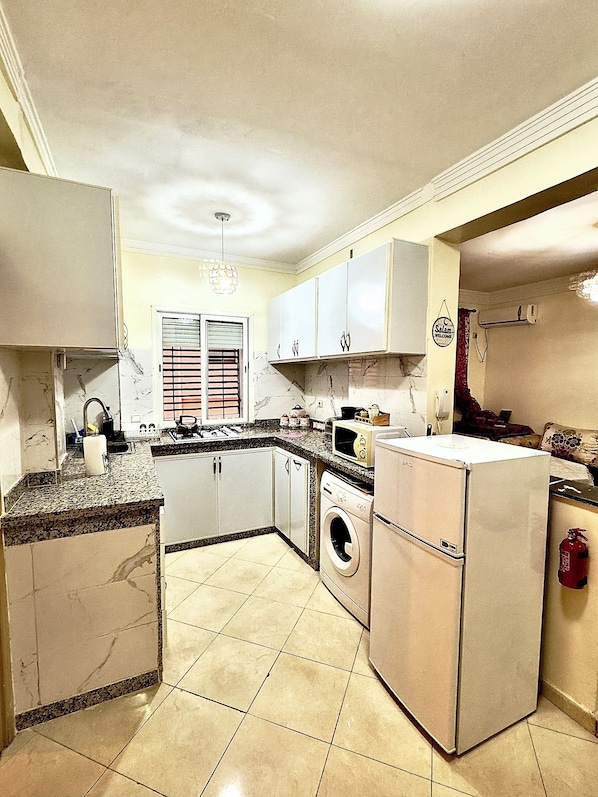Fridge, microwave, stovetop, coffee/tea maker