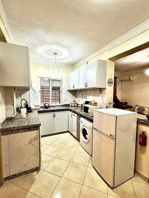 Fridge, microwave, stovetop, coffee/tea maker