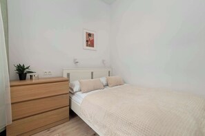 1 bedroom, desk, iron/ironing board, travel crib