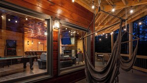An indoor pool area with a billiards table, seating, and a stone fireplace. - Morning Glory - Cherry Log GA (Cherry Log)