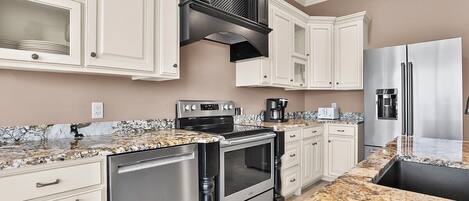 Condo, 4 Bedrooms | Private kitchen | Oven, coffee/tea maker, toaster