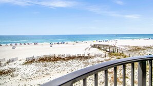 A beach with a wooden boardwalk, sandy beach, and ocean view. - Phoenix Ix 307 2 Bedroom Condo (Orange Beach)