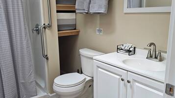 Shower, hair dryer, towels, soap