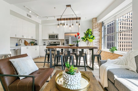 Premium Condo, 4 Bedrooms | Living room | 50-inch Smart TV with digital channels, foosball. California Building