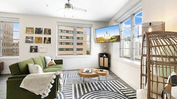 Premier Condo, 2 Bedrooms | Living room | 50-inch Smart TV with digital channels, foosball