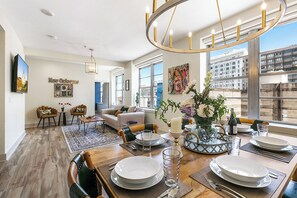 Premier Three Bedroom Residence | Living room | 50-inch Smart TV with digital channels, foosball - California Building (New Orleans)