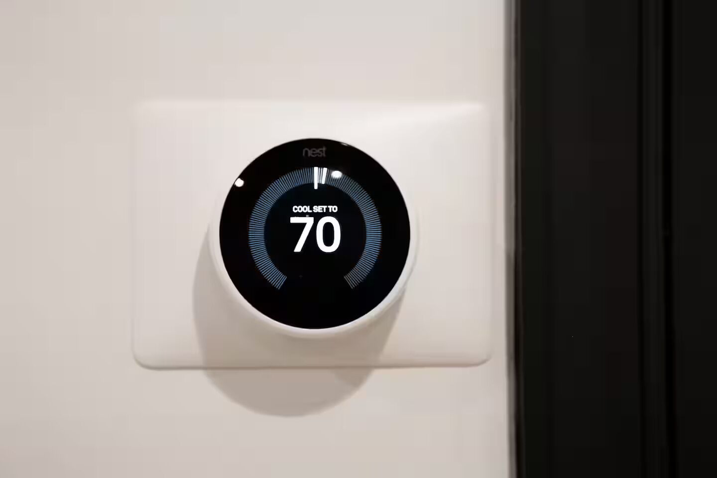 A Nest thermostat set to 70 degrees Fahrenheit.