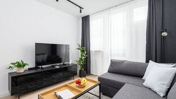 Televisión de pantalla plana de 50 cm con canales por cable