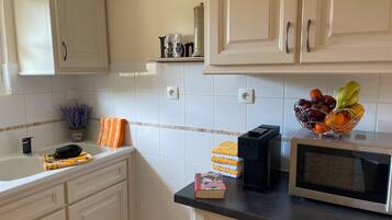 Fridge, microwave, stovetop, coffee/tea maker