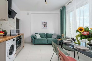 Comfort Apartment, City View | Living area | 40-inch flat-screen TV with digital channels - Lumina 3-room apart in the center Warsaw (Warsaw)