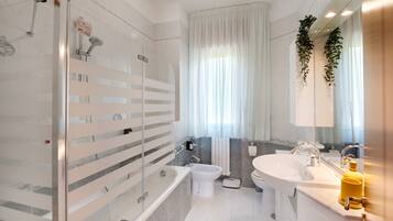 Shower, free toiletries, hair dryer, towels
