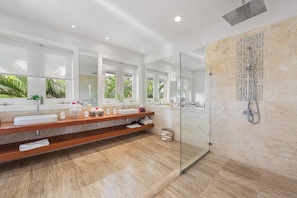 Shower, hair dryer, towels, shampoo